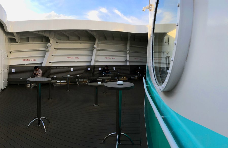 Costa-Smeralda-Crew-Bar-open-deck-smoking-area-tables.jpg